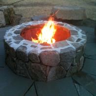 Firepit in patio, lit.